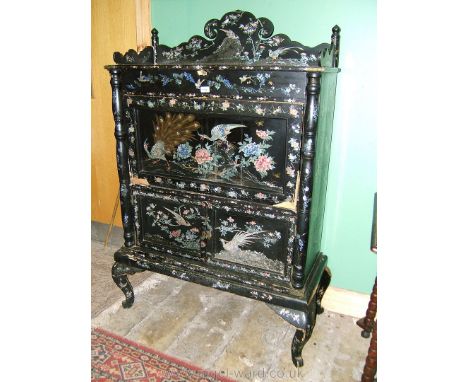 A spectacular 19th c. ebonised lacquered Oriental Bureau Cabinet having shaped upstand to the rectangular top over a long fri