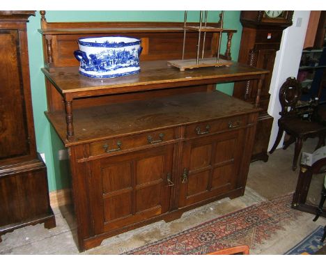 An Edwardian Mahogany Buffet Sideboard, having upstand back with two shelves on turned supports, one narrow, the other full d