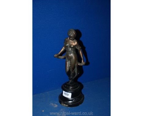 A bronze figure of a girl, 12" tall.