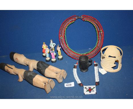 Miscellaneous ethnic items including bead work necklace, carved ivory bangle, wooden figures etc.