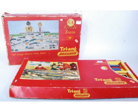 Two Triang train sets R2x appears complete but in poor box (G-BP) and an RS14 set containing 4 first series TC blue yellow pa