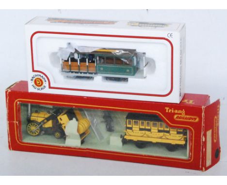 A Triang Stephensons Rocket train pack containing locomotive, tender, Times coach and train crew (G-BF), together with Bachma