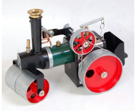 A Mamod SR1A loose steam roller, comprising of green, black and red body with base metal rollers, sold with original scuttle 