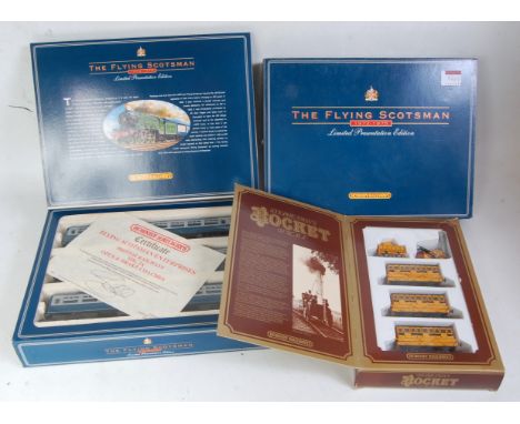 A Hornby Stephensons 'Rocket' train pack containing engine, tender and 3 coaches (G-BG), together with 'Flying Scotman' limit