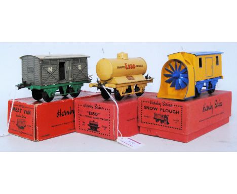 Three pre-war Hornby wgaons: 1934-6 snowplough, plain, blue standard base, yellow body, blue lined plough, no lamp, blue roof