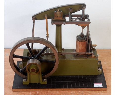 A Stuart Turner beam engine, comprising of a green body to include wooden clad vertical single cylinder with steam and exhaus