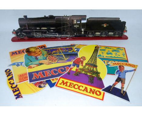 A collection of six reproduction Meccano showcards with a photographic enlargement showcard of 8F No. 48151 on a wooden base,