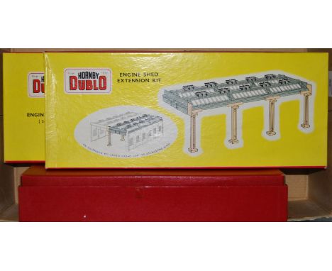 Three Hornby Dublo plastic kits: 5005 engine shed, 5006 extension kit (appears unused) and 5020 goods depot (red box) all unc