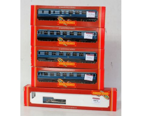 A Hornby R685 LMS blue/silver streamlined 'Coronation' engine and tender together with 3x R422 and 1x R423 matching coaches (