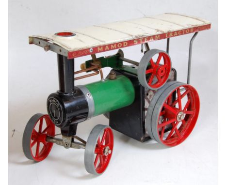 A Mamod TE1A traction engine of usual specification, with original burner and steering rod (missing scuttle)