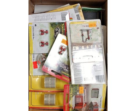 A large shoebox containing unopened Hornby "Lyddlend 9 Mil" accessories including station platforms, tractors, steps, engine 