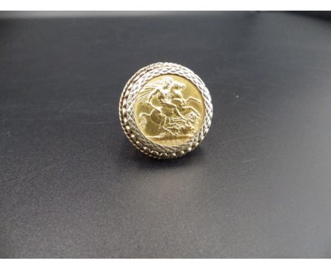 1958 Elizabeth II full sovereign in a 9ct gold surround ring size N 13.84g total weight