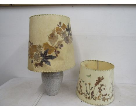 Vintage parchment shades with pressed leaves and flowers, one on a ceramic lamp base