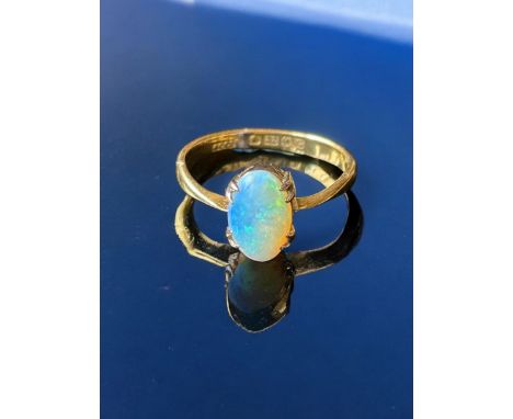 22ct gold ring, with a white opal size 'N' 2.71g total weight.