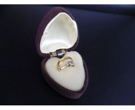 22ct hallmarked gold band ring size M, 2.94g and an 18ct hallmarked gold solitare diamond ring size M, 2.24g total weight.