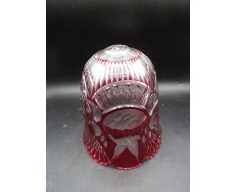 A heavy cranberry light shade with fowl etchings&nbsp;