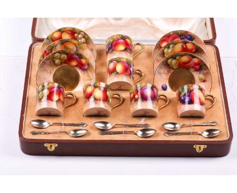 A Royal Worcester porcelain coffee service with silver spoons, in a fitted Asprey case, each piece with hand-painted fruit de