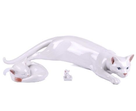 A Royal Copenhagen large white ceramic cat, model 059, 45 cm wide, together with two smaller Royal Copenhagen itemsQty: 3