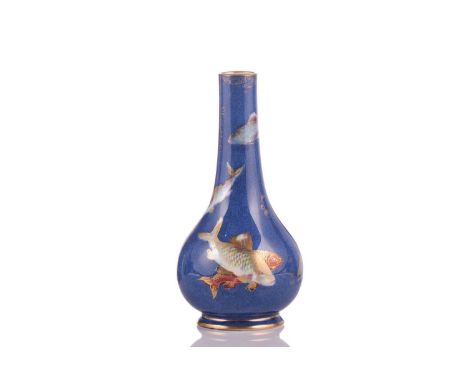 Daisy Makeig Jones (British, 1881-1945) for Wedgwood; a powder blue lustre bottle vase painted with swimming fish in lustrous