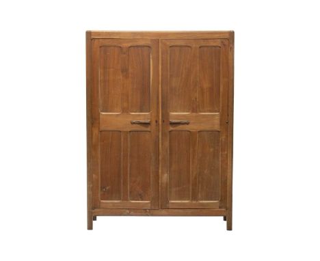 A Gordon Russell Workshops English walnut 'Lygon' wardrobe, c.1925, two full-length panelled cupboard doors enclosing a fitte