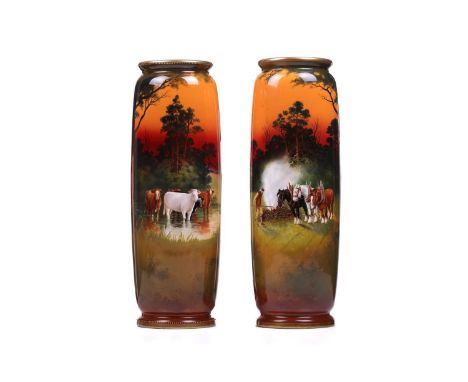 A near pair of very large Royal Doulton cylindrical vases, each decorated with animals in countryside scene, signed 'H. Morre