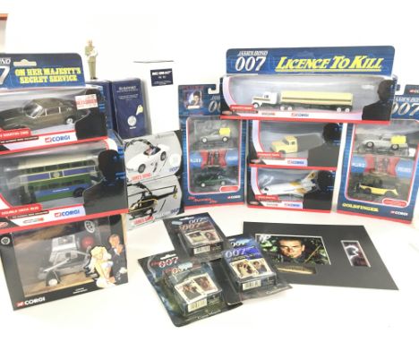 A Collection of Boxed Corgi James Bond Vehicles. A Never Say Never Again Film Cell and playing Cards.