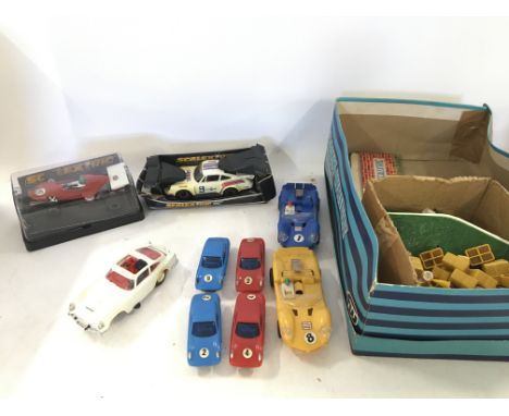 A Box Containing Scalextric and other slot Cars in Various States. Also Track and other Accessories.