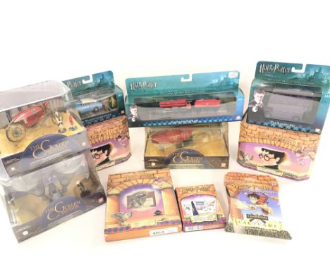 A Box Containing a Collection of Boxed Harry Potter And the Golders Compass Itmes.