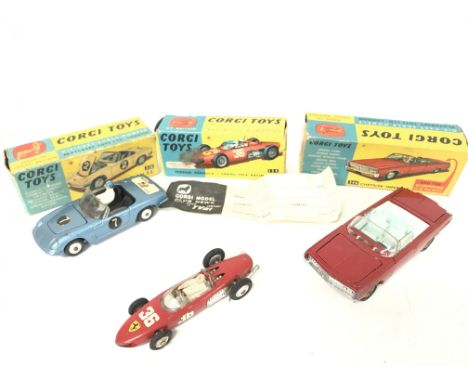 A Boxed Corgi Lotus Elan S2 #318. A Ferrari Formula 1 Car #154 and a Chrysler Imperial #246.