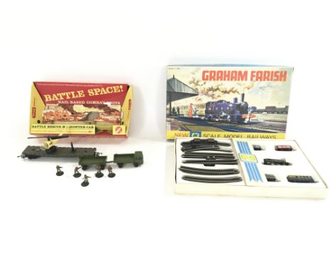 A Tri-ang battle rescue helicopter car and a N gauge Graham Farish train set.