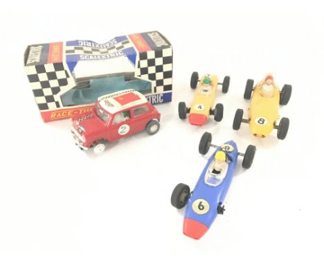 A Boxed Scalextric Rally Mini Cooper. C7 Red.A/F with a Box Of Track and Loose Cars.