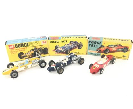 A Boxed Corgi Cooper-Maserati #159. A Cooper-Maserati #156 and a Ferrari #154.