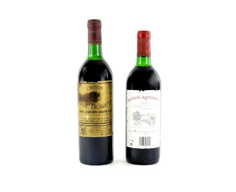 Two bottles of red wine to include one bottle of Chateau Franc Bigaroux Saint Emilion Grand Cru 1986 vintage, one bottle of M