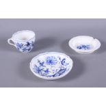 A Meissen blue and white decorated coffee cup, a similar saucer and a similar ashtray