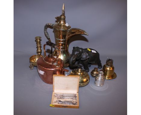 A metal model of an elephant, a Persian brass ewer, a copper kettle and various other metalware