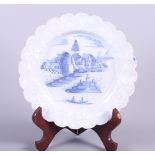 An early 18th century Bristol bianca sopra plate with waived rim and landscape with fisherman