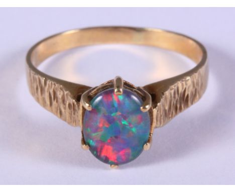 A 9ct gold and opal single stone dress ring, size R