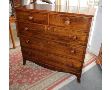 An early 19th century rosewood chest of two short and three long drawers, on cut away bracket supports, 43" wide