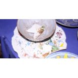 An English Delft? pottery charger, brightly decorated with sprays of flowers within a scalloped