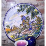 A Spanish majolica charger with Don Quixote and Sancho Panzer decoration, 18" dia
