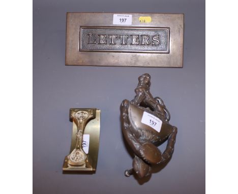 A brass letter box, a door knocker and an Art Nouveau design desk blotter