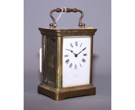 A brass cased carriage clock with white enamel dial signed J.C. Vickery London (a/f)