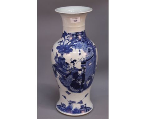 A Chinese blue and white porcelain baluster vase decorated with Chinese man seated in a garden, bearing six character Kangxi 