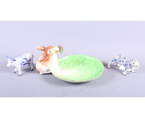 An 18th century Continental model of a tiger, 4 1/4" long (leg restored), a ceramic dish with a rabbit, 8 1/2" wide, and a De