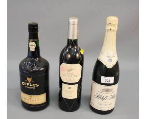 A bottle of Offley port, another bottle of port and a bottle of Schloss Frier sparkling table wine