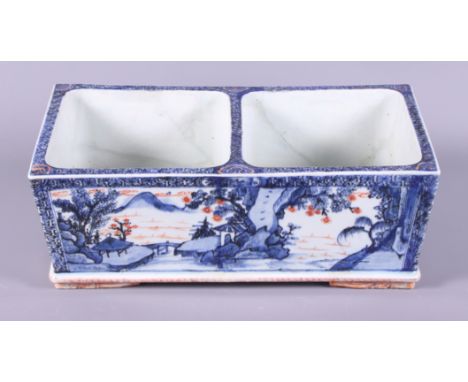 A late 19th century Chinese Imari two-section planter, decorated with a mountainous village scene, with a river flowing, on b