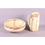 A Royal Doulton Art Nouveau designed toilet jug and basin (rim chipped to basin), jug 2" high