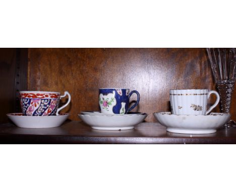 A 19th century Barr Flight Barr 'Queen Charlotte' pattern cup and saucer, a Worcester First Period porcelain cup and saucer o
