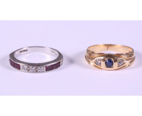 An 18ct white gold, diamond and ruby half eternity ring, size Q, and an 18ct gold, diamond and sapphire three stone dress rin