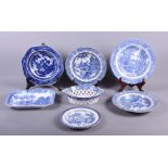 An early 19th century blue and white transfer decorated chestnut basket, a similar osier plate, four